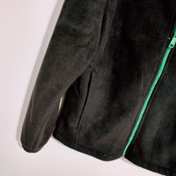 Columbia black fuzzy jacket with green at the zipper. Size small - Picture 2 of 4